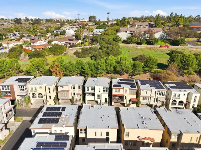 a kitchen with stainless steel appliances a stove a sink and a refrigerator