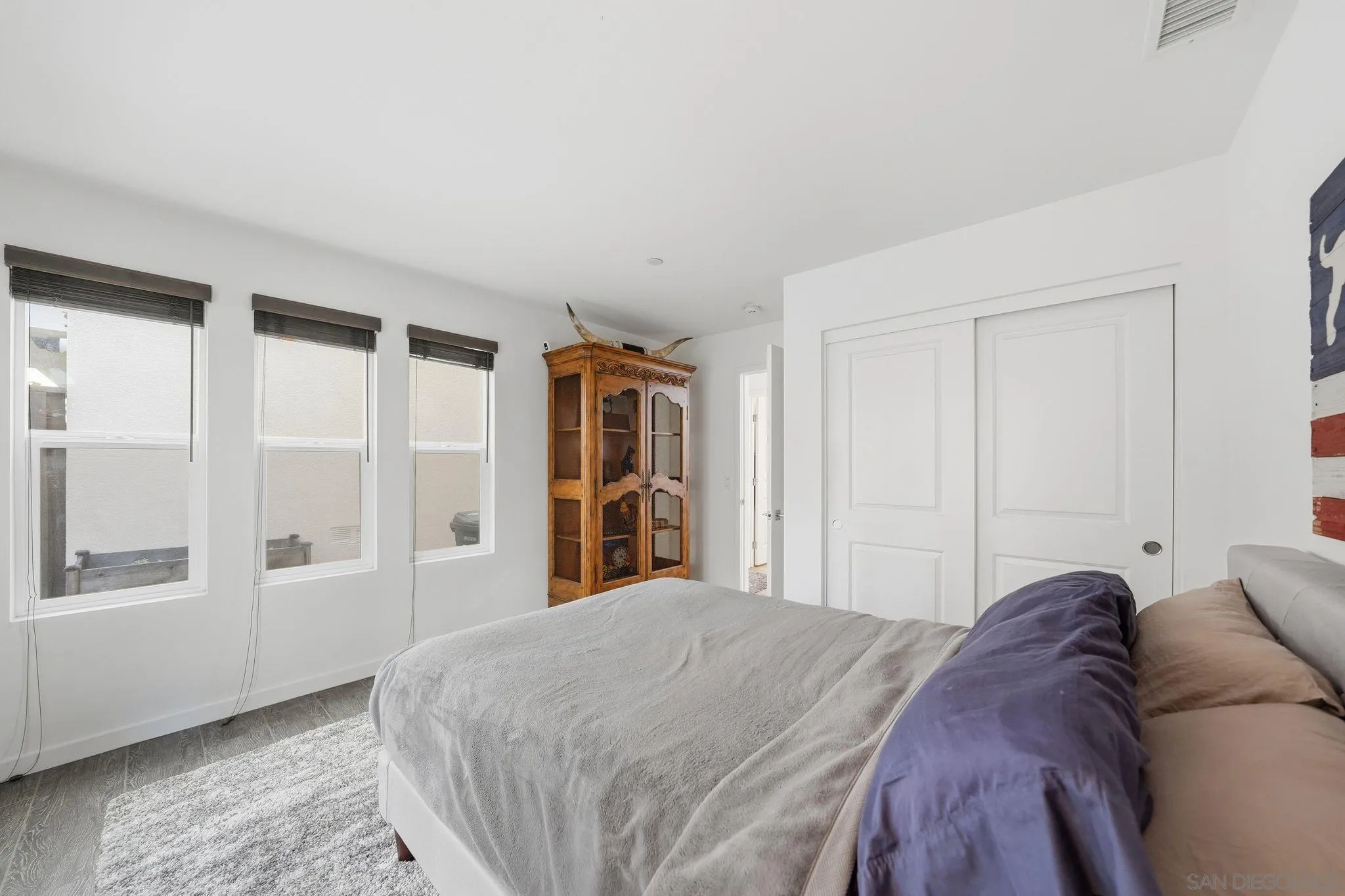 8337 Summit Way San Diego, CA 92108 - Photo 31 of 61 a bed sitting in a bedroom next to a window