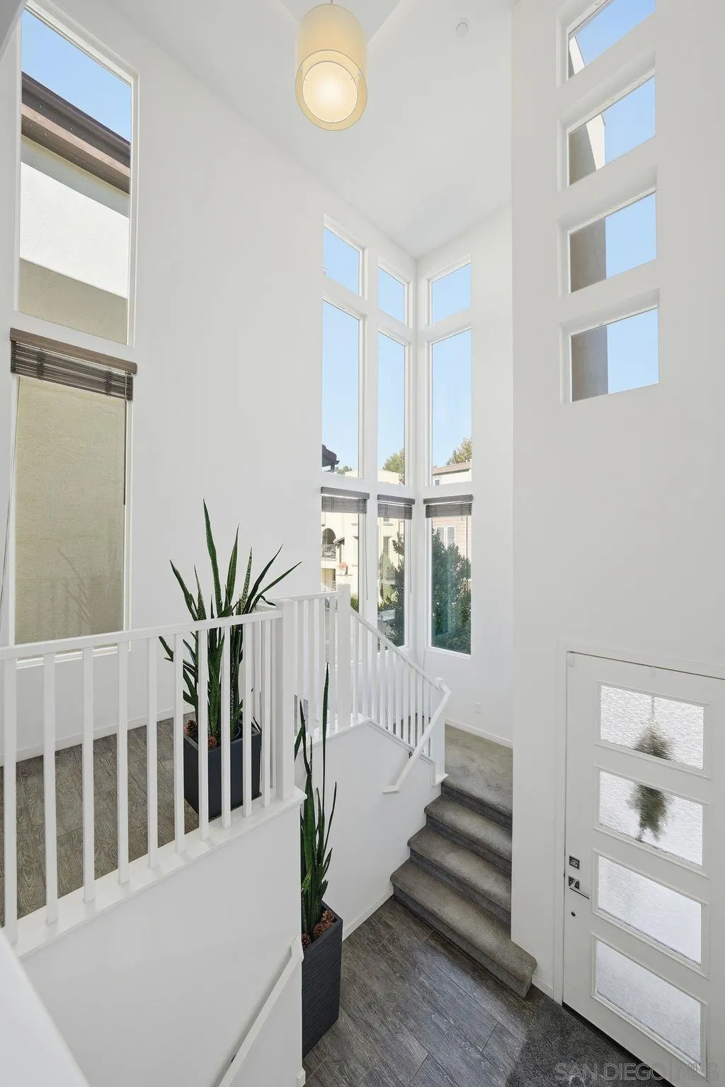 8337 Summit Way San Diego, CA 92108 - Photo 4 of 61 a view of staircase with white walls and a window