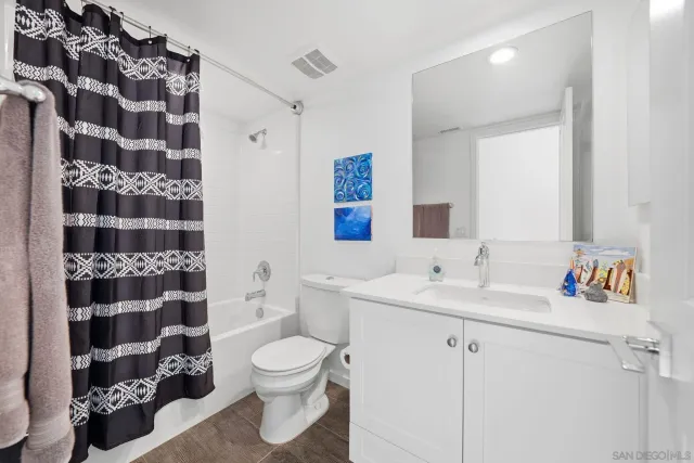 a spacious bedroom with a bed and a couch