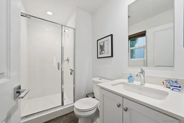 a view of a patio with couches table and chairs and potted plants