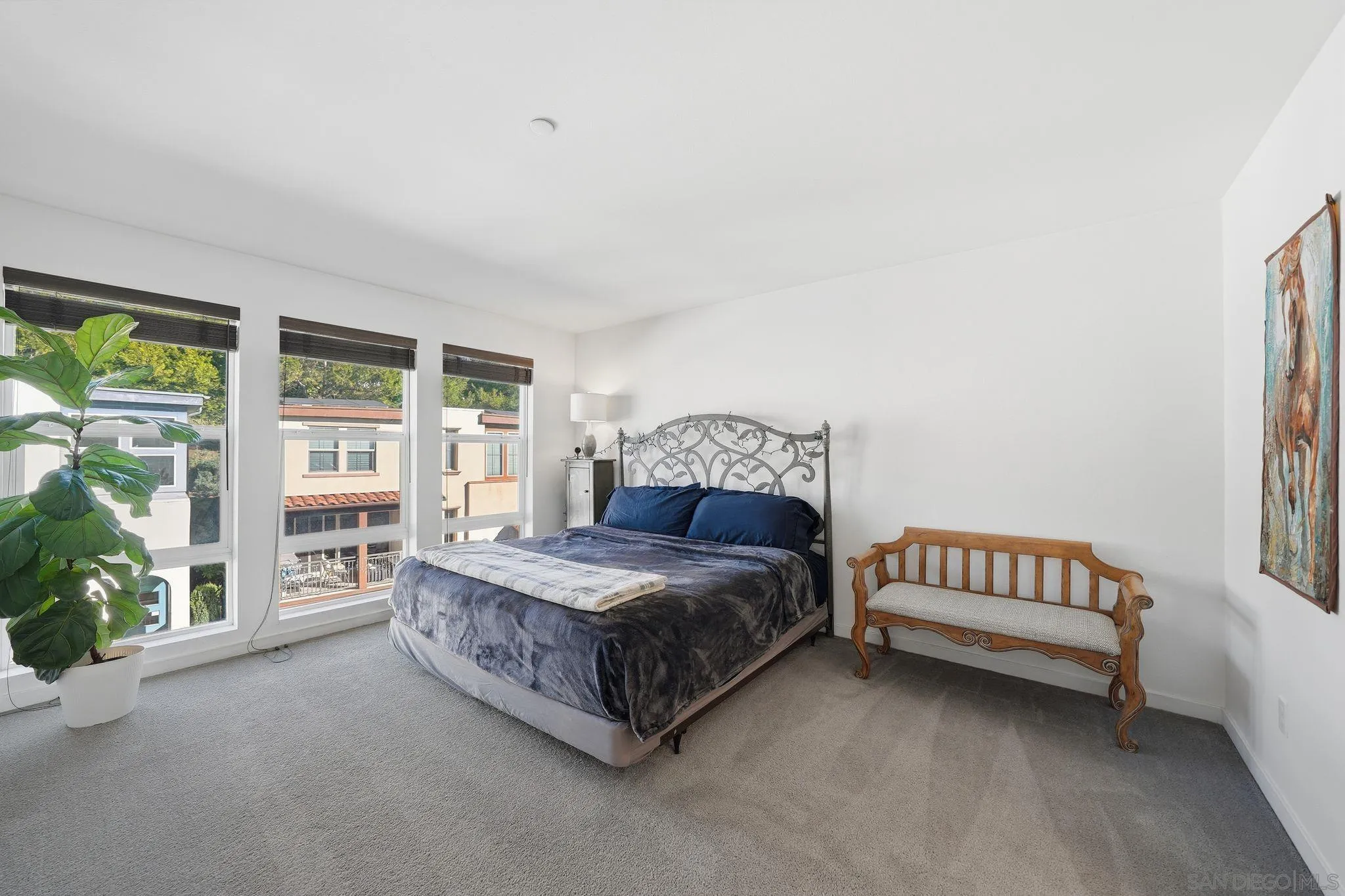 8337 Summit Way San Diego, CA 92108 - Photo 51 of 61 a spacious bedroom with a bed and a couch