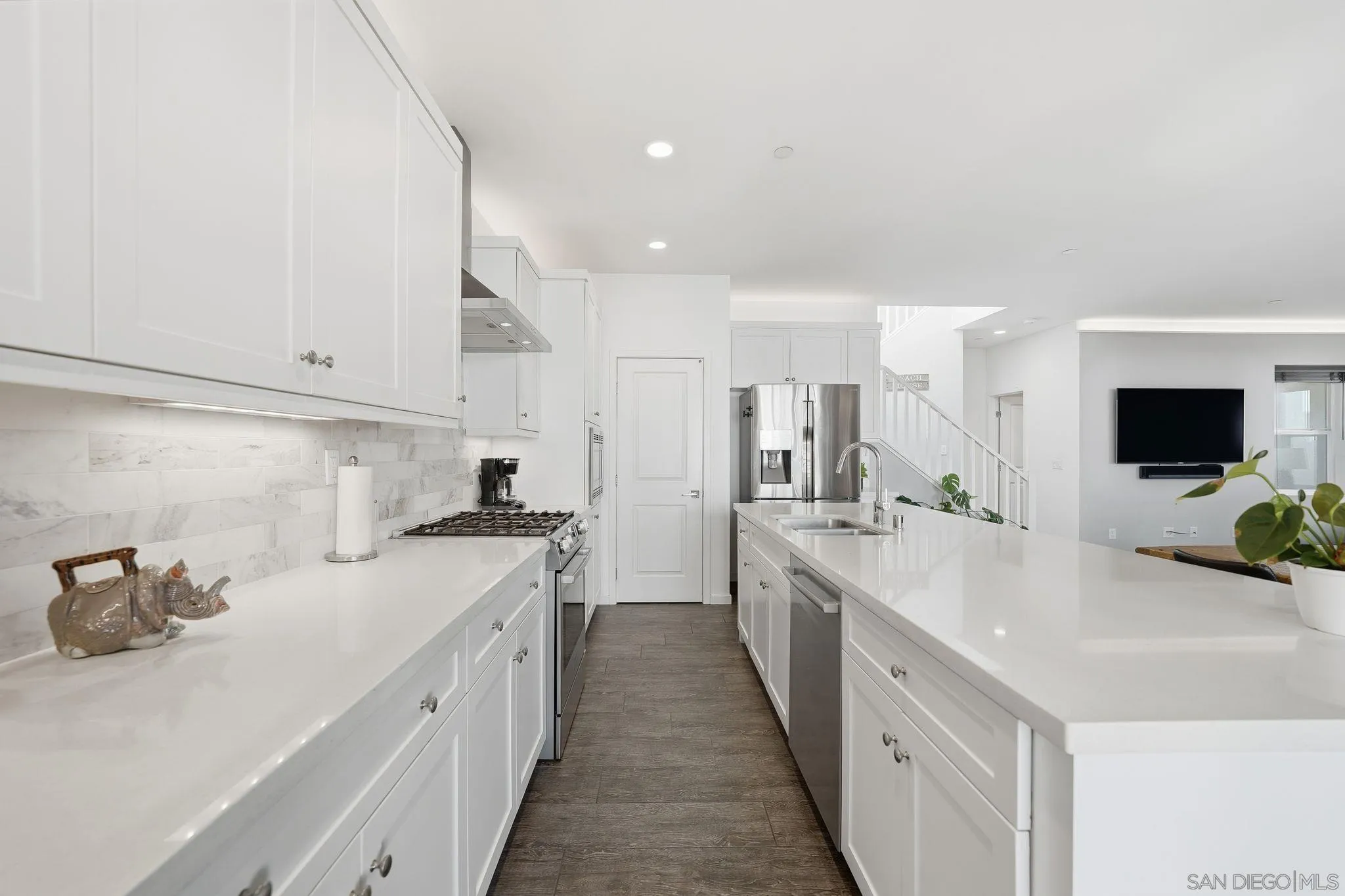 8337 Summit Way San Diego, CA 92108 - Photo 7 of 61 a kitchen with a sink stove and cabinets