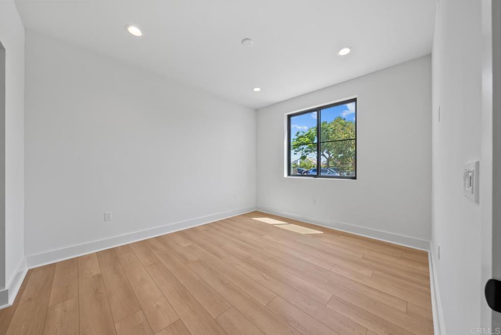 1101 Catania, Unit 104 Encinitas, CA 92024 - Photo 12 of 41 wooden floor in a hall with a window