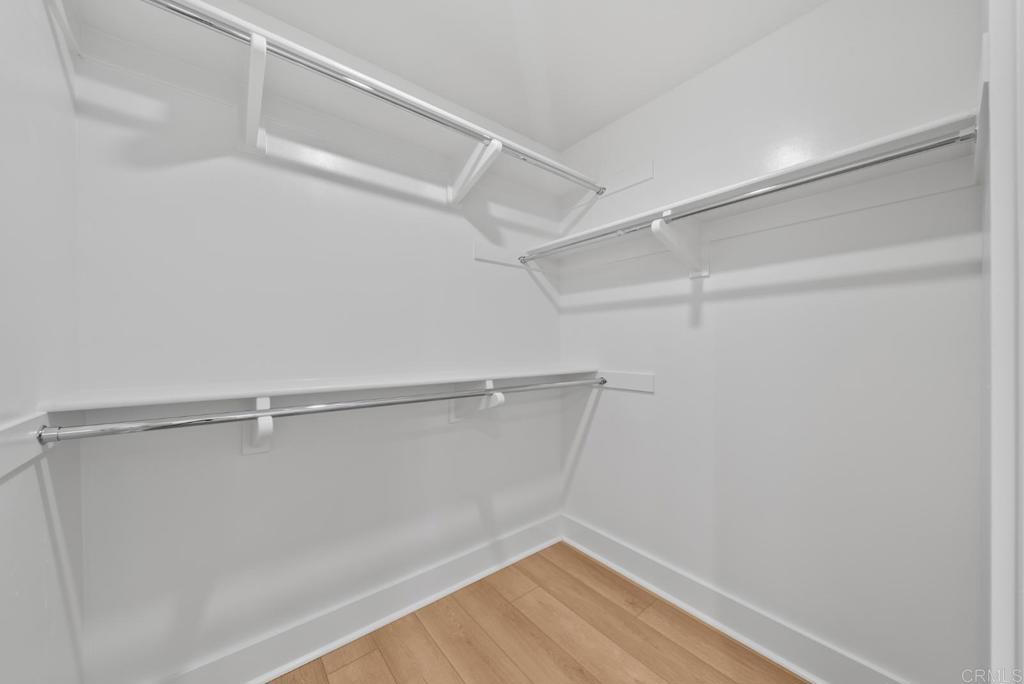 1101 Catania, Unit 104 Encinitas, CA 92024 - Photo 17 of 41 a view of a room with racks on the wall