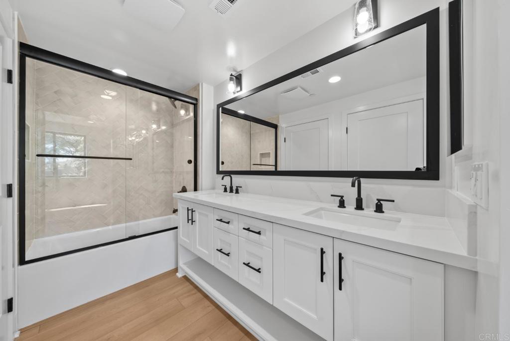 1101 Catania, Unit 104 Encinitas, CA 92024 - Photo 22 of 41 a bathroom with a sink and a mirror
