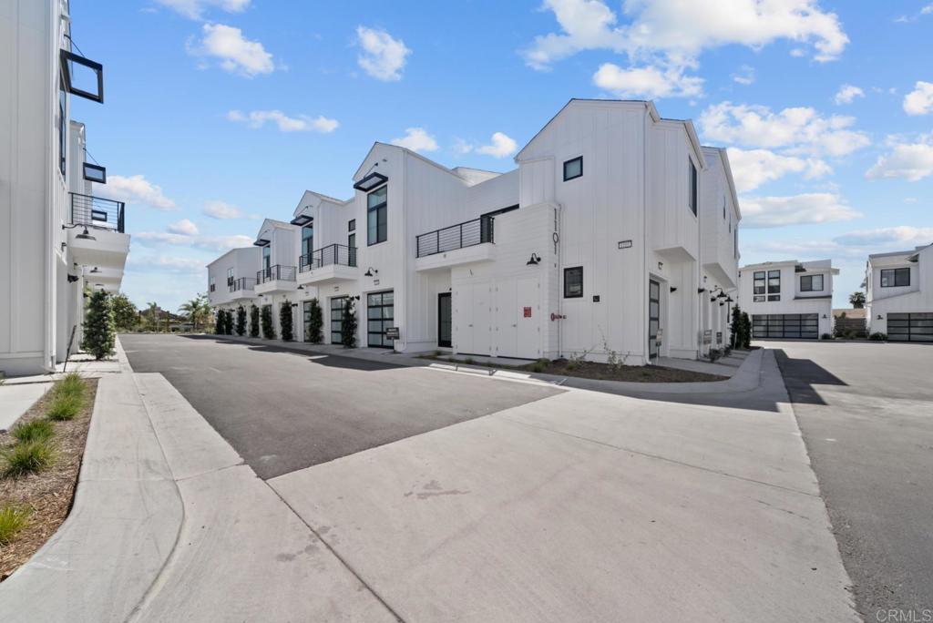1101 Catania, Unit 104 Encinitas, CA 92024 - Photo 29 of 41 a view of a street with a building