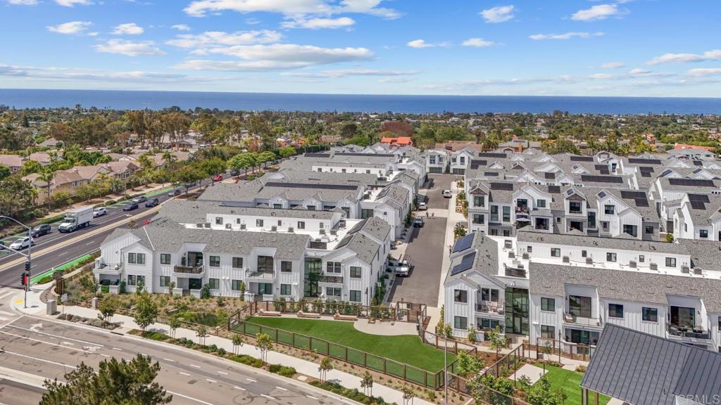 1101 Catania, Unit 104 Encinitas, CA 92024 - Photo 40 of 41 a view of a large building with a city view