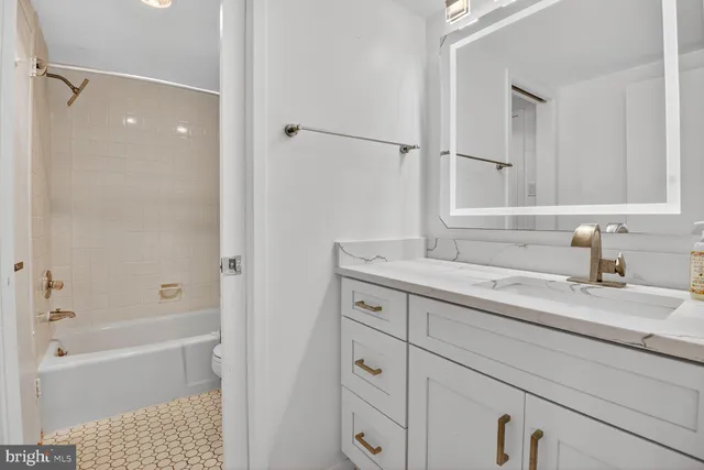 a living room with lots of furniture and a book shelf