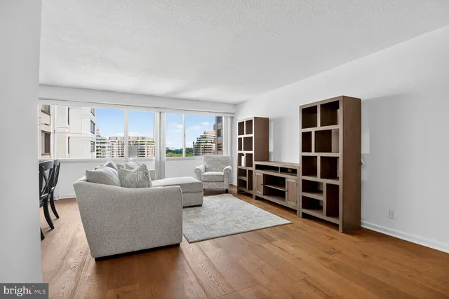 a view of a dining room with furniture and window