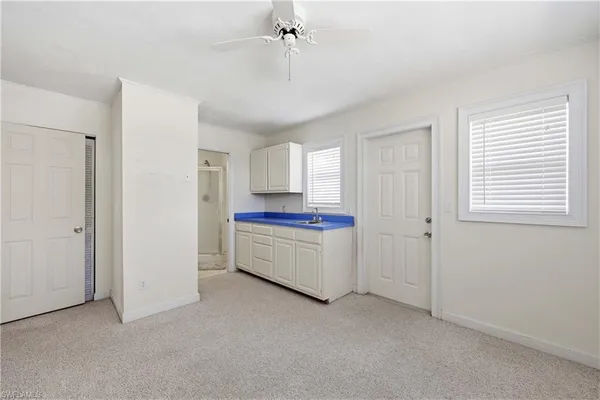 a room with a stove and a refrigerator