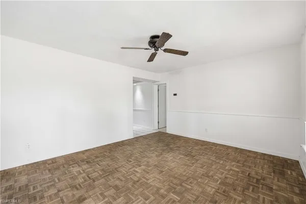 a view of a room with wooden floor