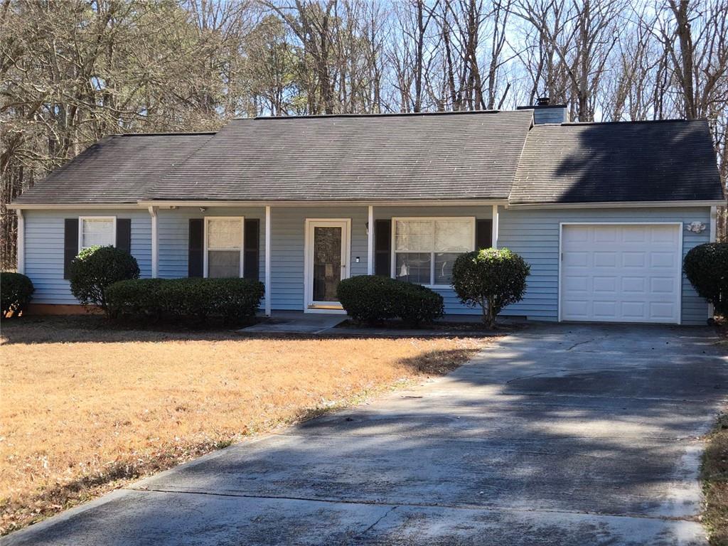 1703 Windy Ridge Court Southeast Conyers, GA 30013 - Photo 1 of 1 a house view with a outdoor space