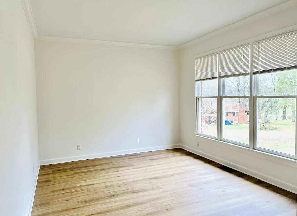 650 Vanderbilt Road Mount Juliet, TN 37122 - Photo 19 of 45 an empty room with wooden floor and windows