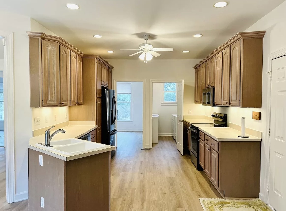 650 Vanderbilt Road Mount Juliet, TN 37122 - Photo 3 of 45 a kitchen with a sink appliances and cabinets