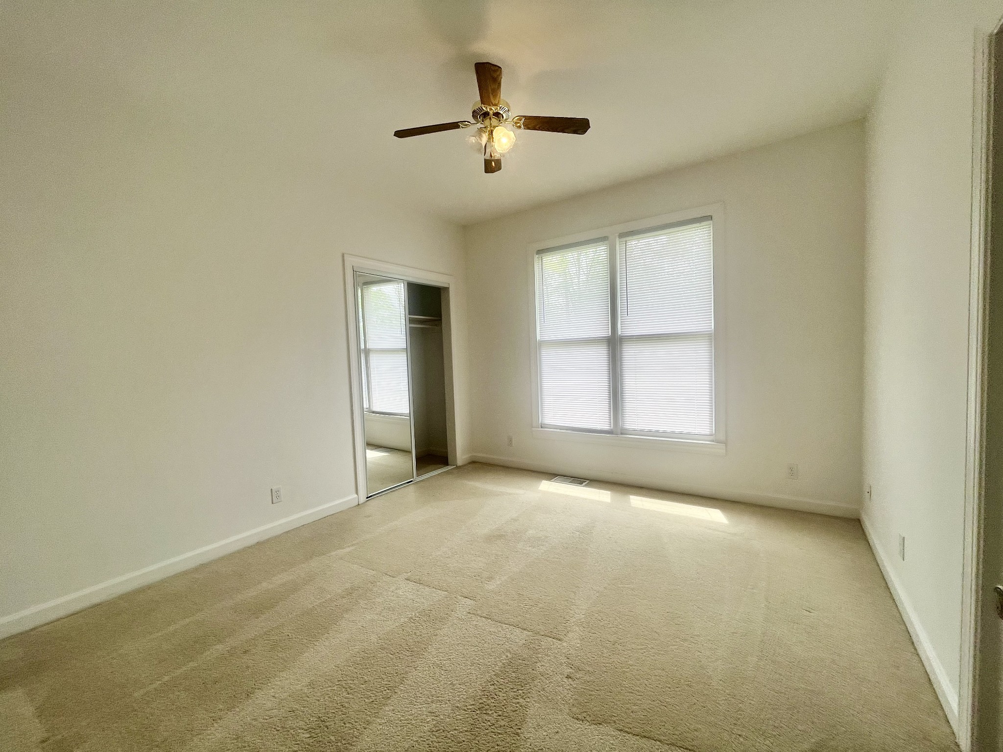 650 Vanderbilt Road Mount Juliet, TN 37122 - Photo 38 of 45 an empty room with chandelier fan and windows