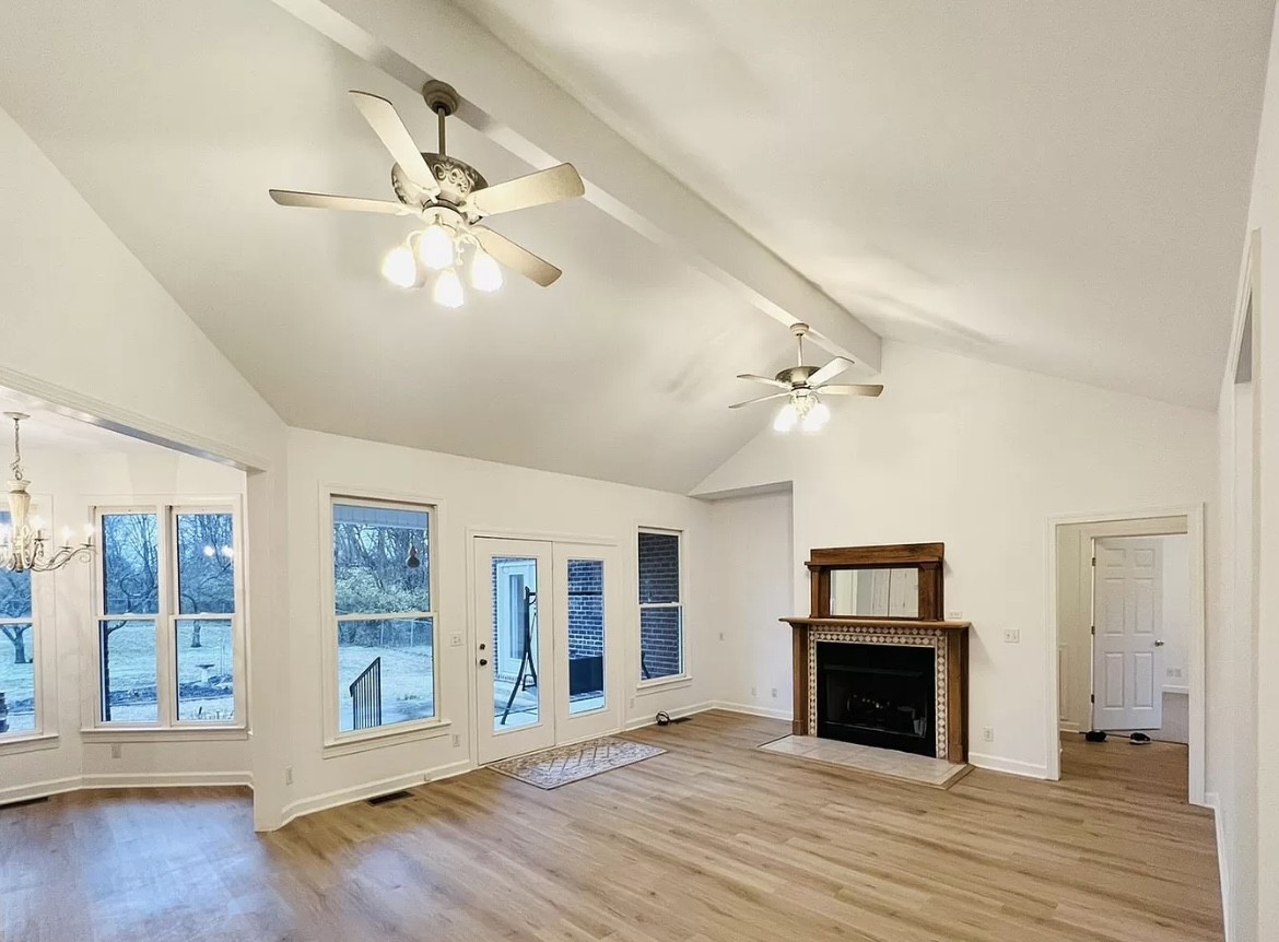 650 Vanderbilt Road Mount Juliet, TN 37122 - Photo 4 of 45 a view of an empty room with wooden floor and a window