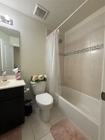 a bathroom with a sink toilet and mirror