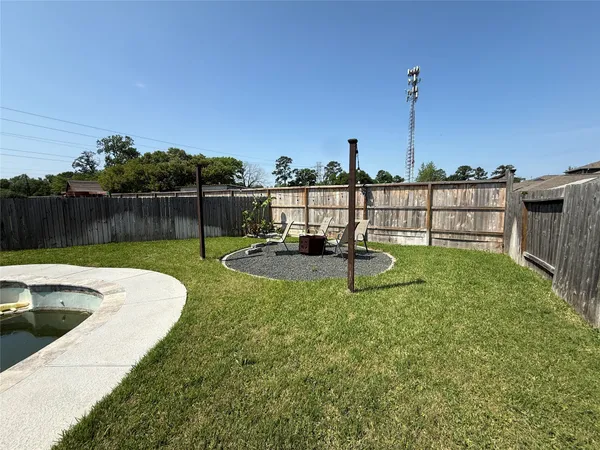 a view of a house with backyard porch and sitting area
