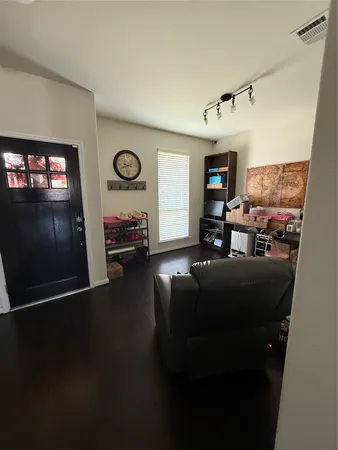 a kitchen with kitchen island granite countertop stainless steel appliances sink stove microwave and cabinets