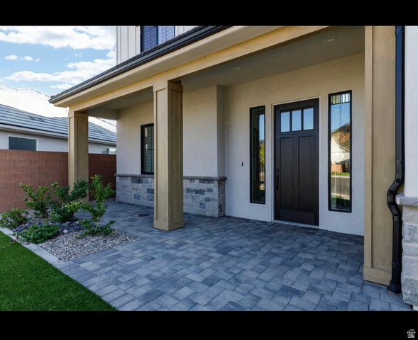 2788 East Rill Drive Washington, UT 84780 - Photo 32 of 41 Covered entry featuring sturdy columns and a paved walkway