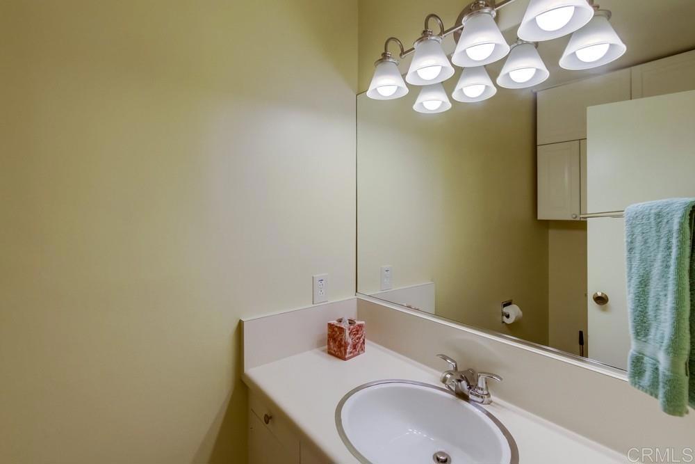 17355 Avenida De Acacias Rancho Santa Fe, CA 92067 - Photo 9 of 16 a bathroom with a sink and a mirror