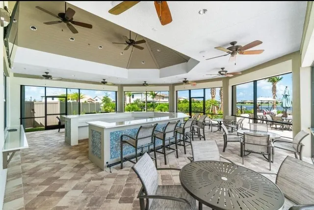 a view of a dining room with furniture wooden floor and chandelier