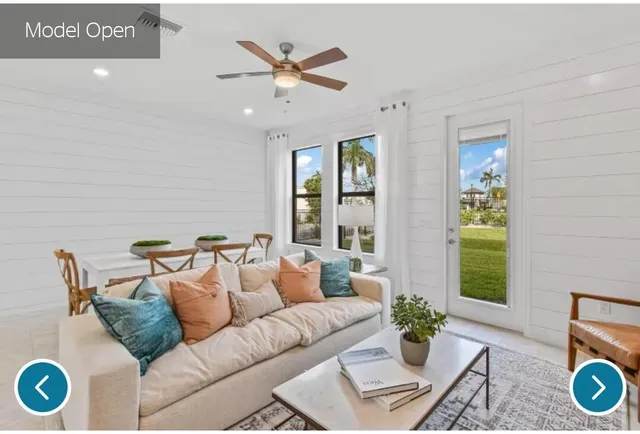 a living room with furniture and a window