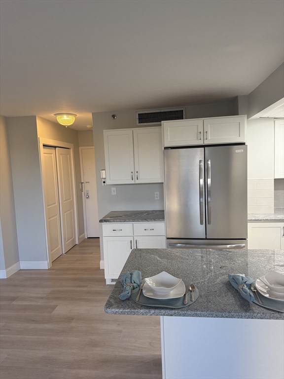 70 Southbridge Street, Unit 215 Worcester, MA 01608 - Photo 11 of 27 a kitchen with a sink and a refrigerator