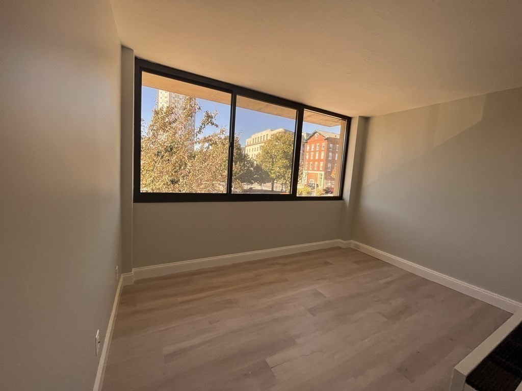 70 Southbridge Street, Unit 215 Worcester, MA 01608 - Photo 16 of 27 a view of an empty room with a window