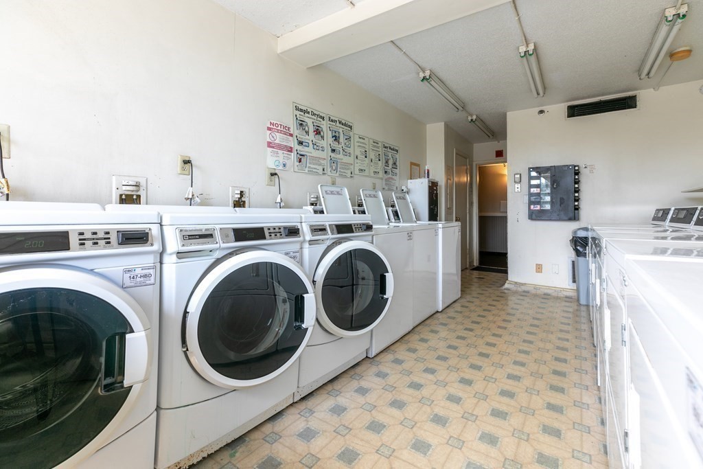 70 Southbridge Street, Unit 215 Worcester, MA 01608 - Photo 22 of 27 a view of a storage & utility room with washer and dryer