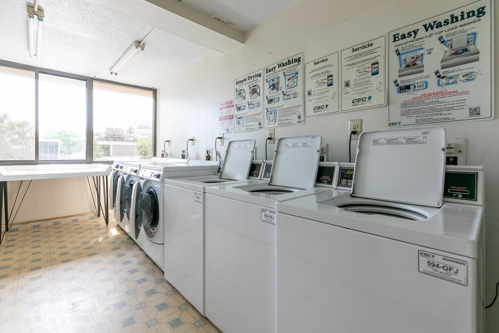 70 Southbridge Street, Unit 215 Worcester, MA 01608 - Photo 23 of 27 a view of a kitchen with washer and dryer