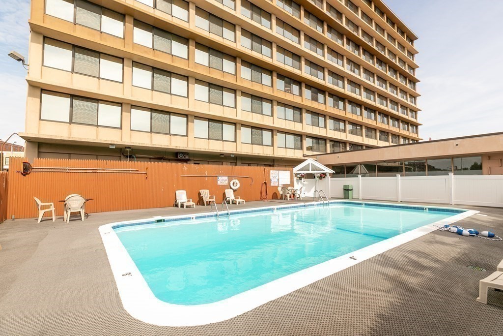 70 Southbridge Street, Unit 215 Worcester, MA 01608 - Photo 24 of 27 a view of a swimming pool with outdoor seating