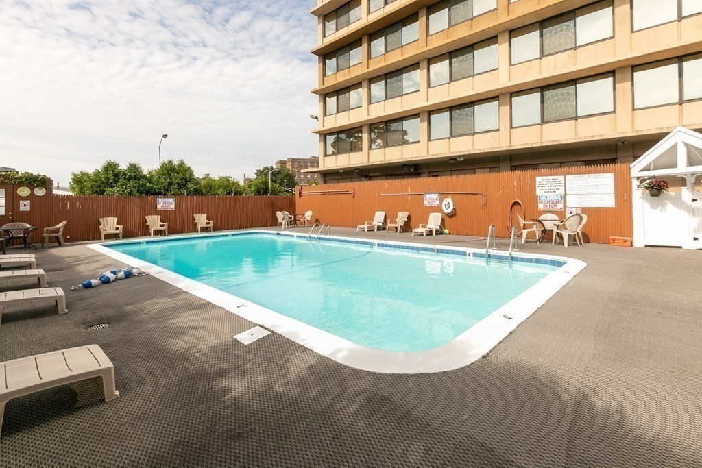70 Southbridge Street, Unit 215 Worcester, MA 01608 - Photo 26 of 27 a view of a swimming pool and an outdoor seating
