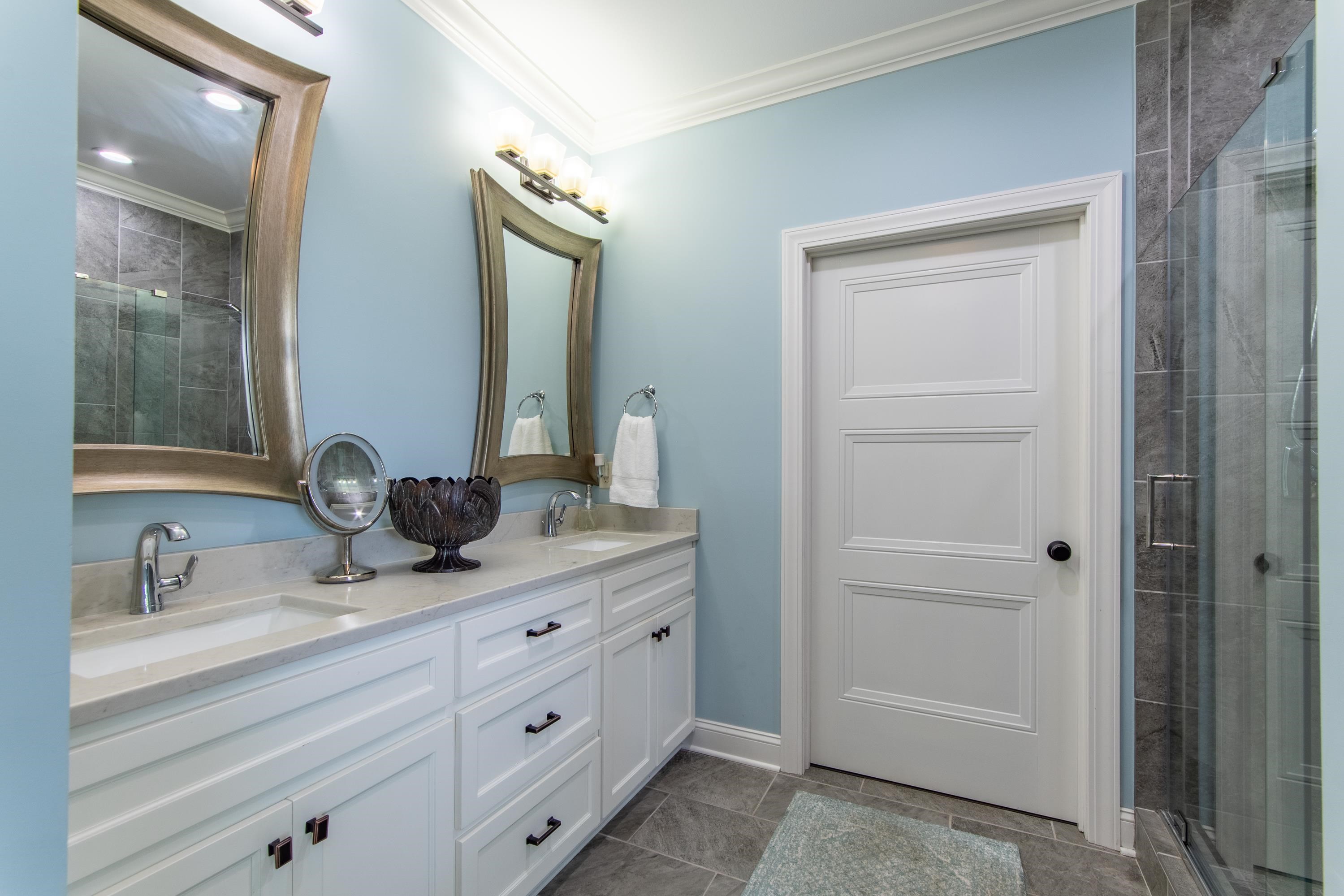 55 Ridge Pointe Drive Savannah, TN 38372 - Photo 14 of 40 Bathroom with double vanity, walk in shower, tile patterned flooring, and ornamental molding