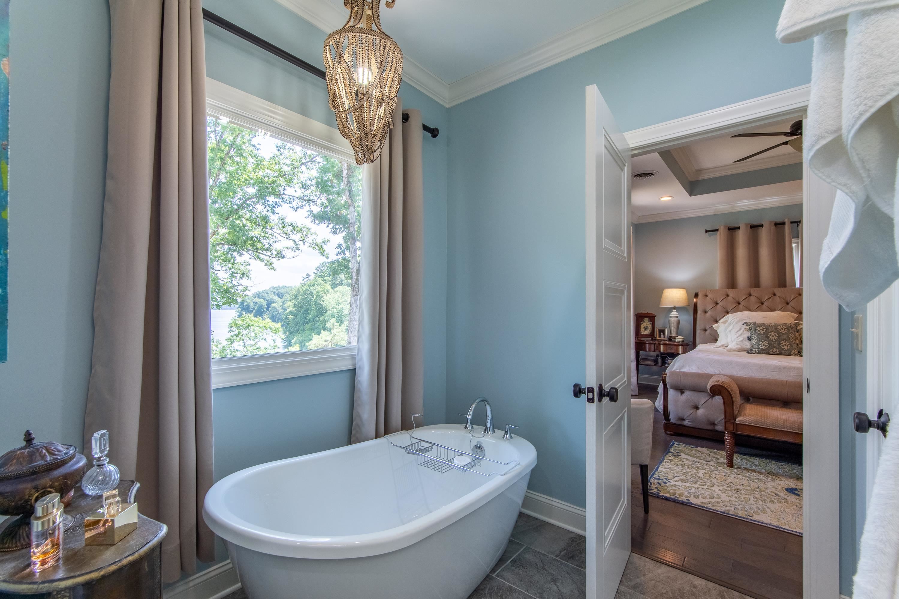 55 Ridge Pointe Drive Savannah, TN 38372 - Photo 15 of 40 Bathroom with plenty of natural light, a tray ceiling, ceiling fan, and ornamental molding