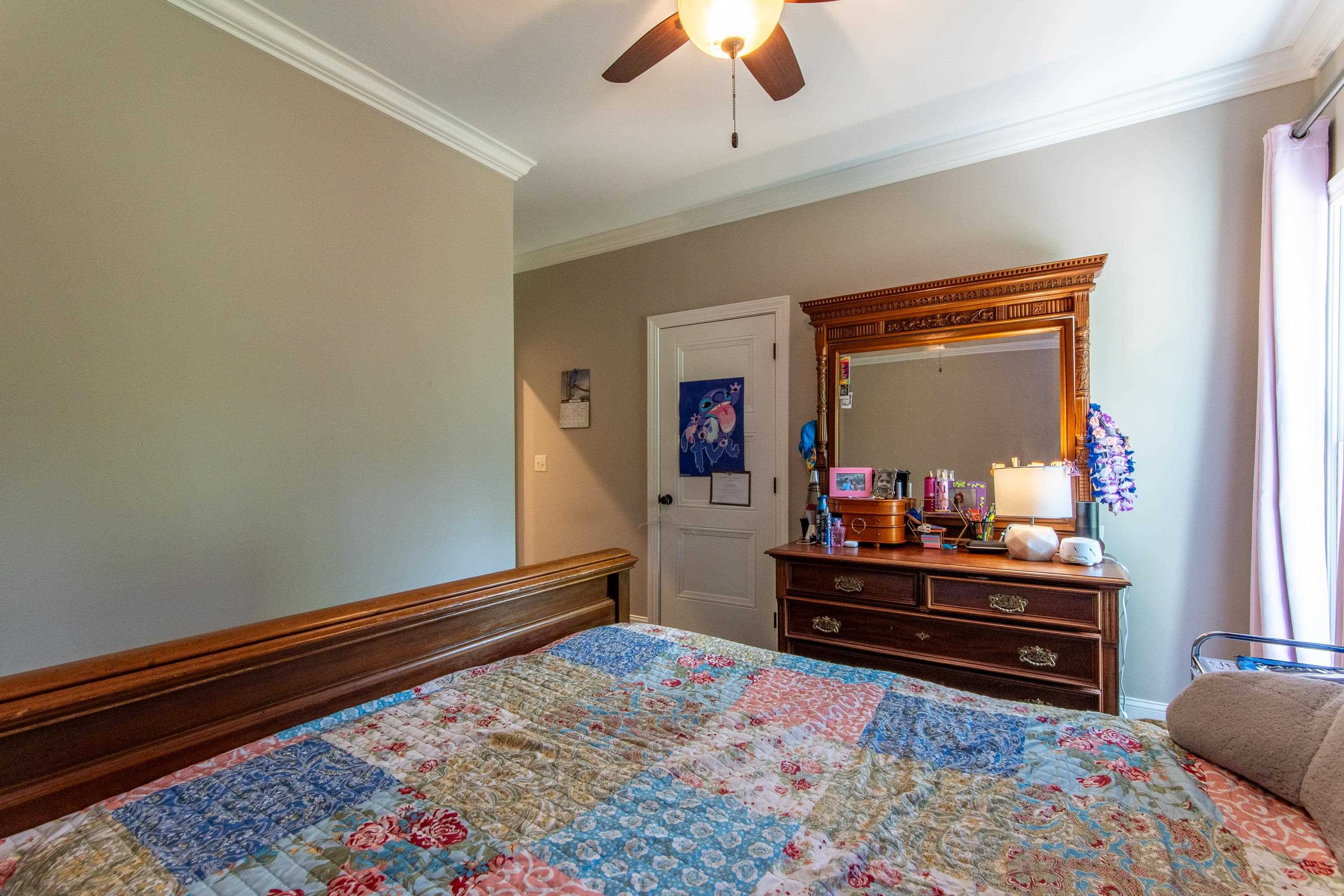 55 Ridge Pointe Drive Savannah, TN 38372 - Photo 19 of 40 Bedroom featuring crown molding and ceiling fan