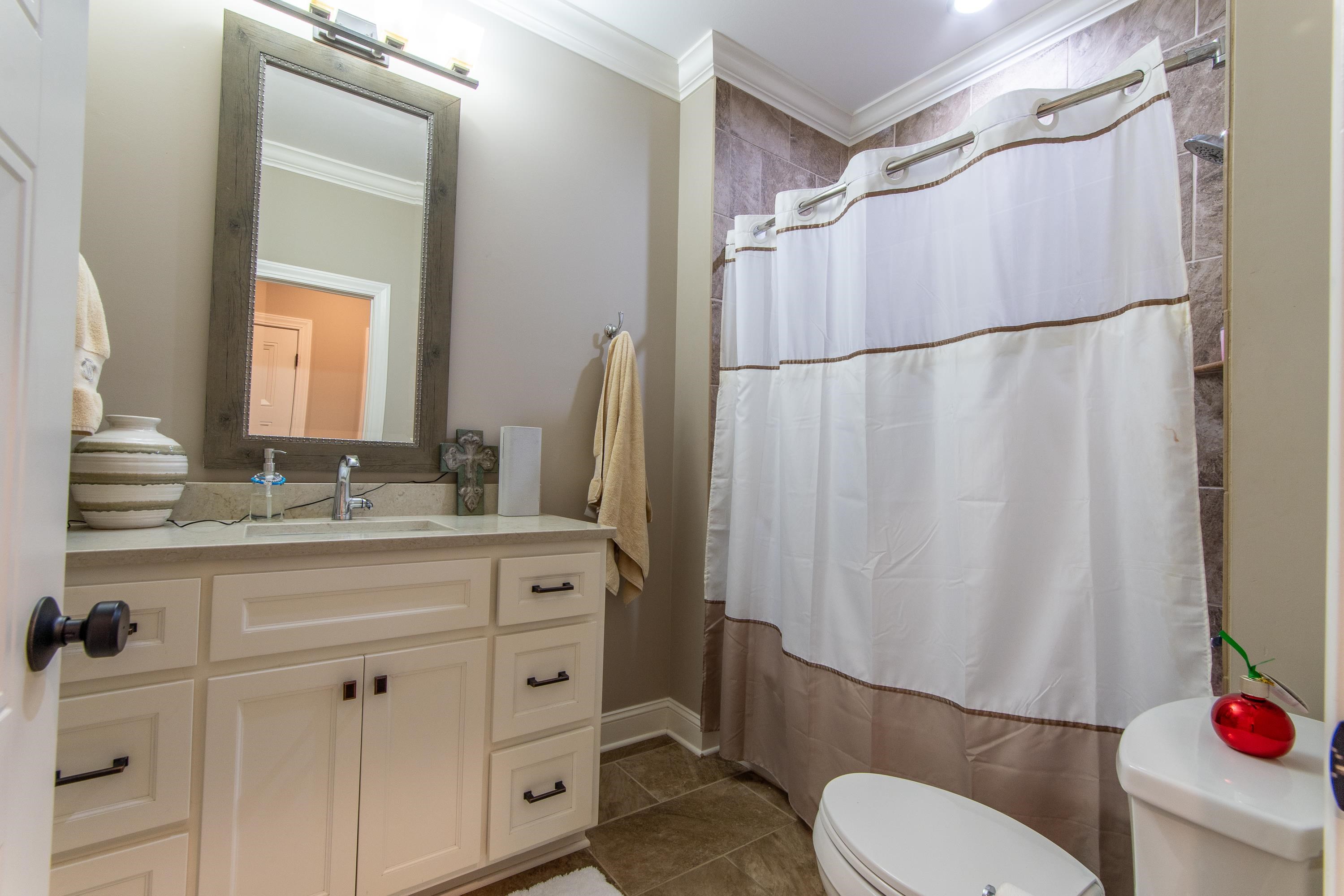 55 Ridge Pointe Drive Savannah, TN 38372 - Photo 20 of 40 Bathroom with tile patterned flooring, toilet, vanity, and ornamental molding