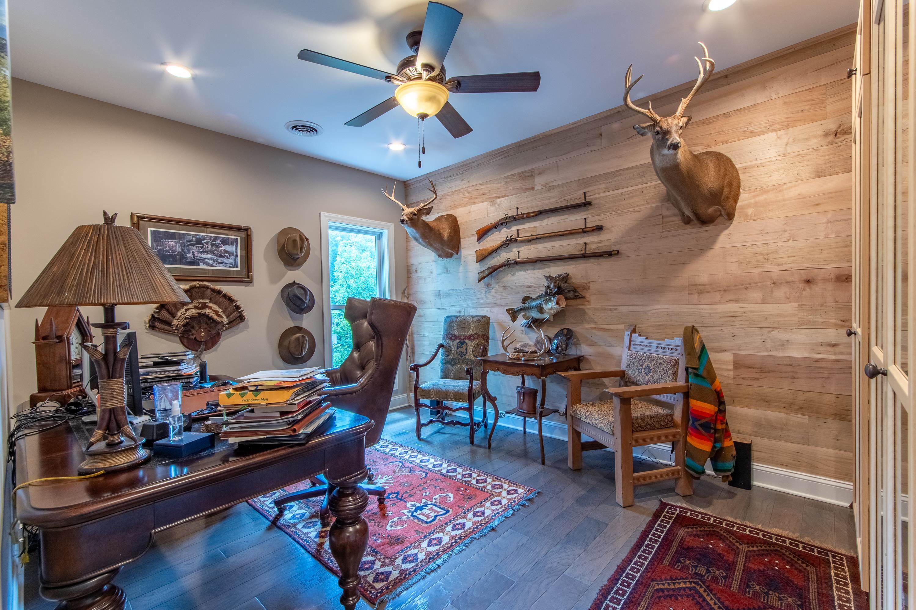 55 Ridge Pointe Drive Savannah, TN 38372 - Photo 27 of 40 Office space featuring wood-type flooring, wooden walls, and ceiling fan