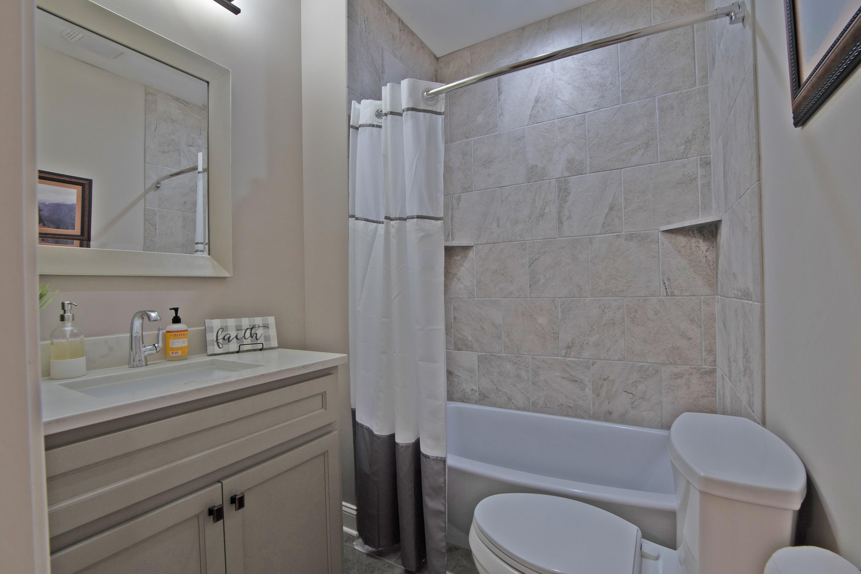 55 Ridge Pointe Drive Savannah, TN 38372 - Photo 29 of 40 Full bathroom featuring shower / bath combo with shower curtain, toilet, and vanity