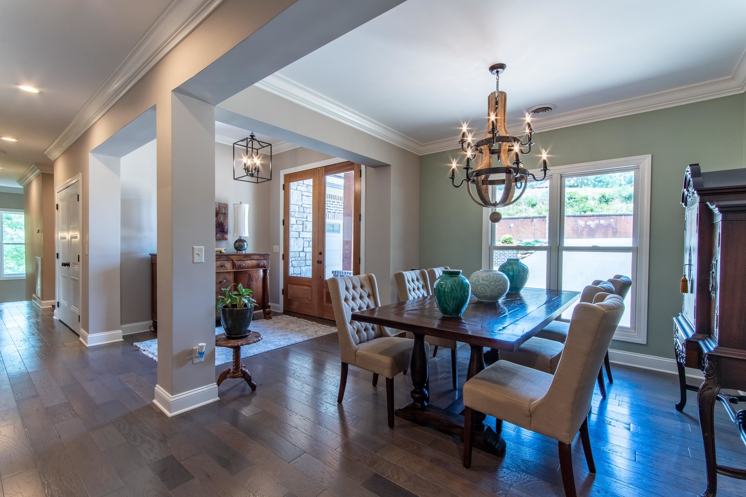55 Ridge Pointe Drive Savannah, TN 38372 - Photo 9 of 40 Dining area featuring a chandelier, dark hardwood / wood-style floors, and ornamental molding