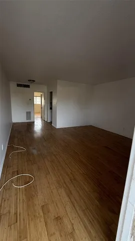 a view of a livingroom with wooden floor