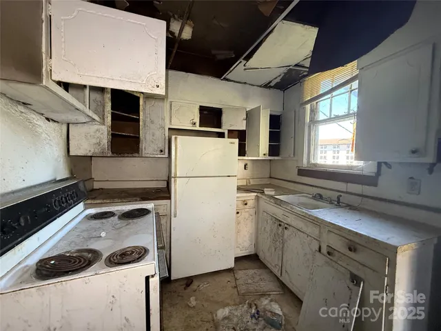 a kitchen with a sink stove and refrigerator