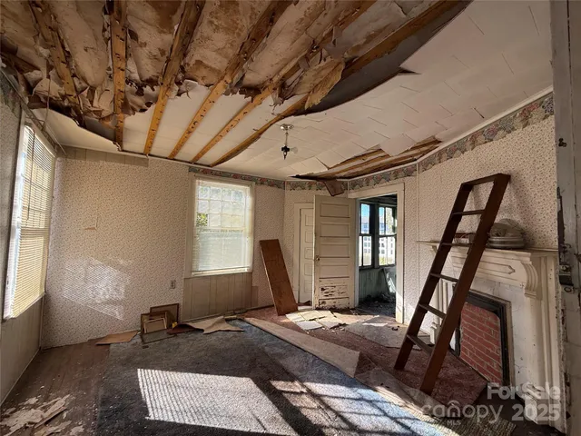 a bathroom with a glass door shower and a sink