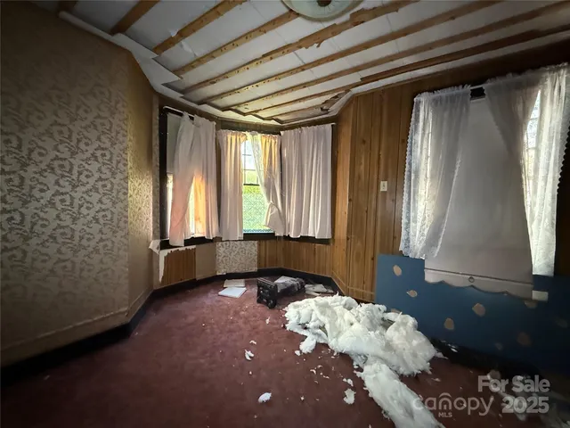 a bed room with a bed and a window