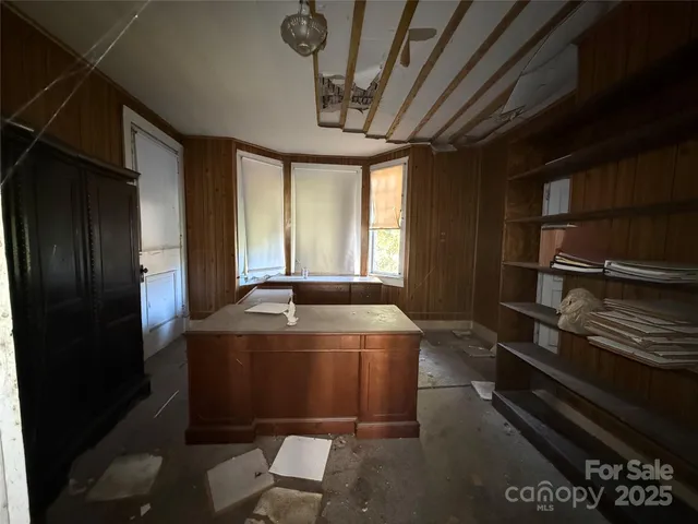 a kitchen with a refrigerator and a sink