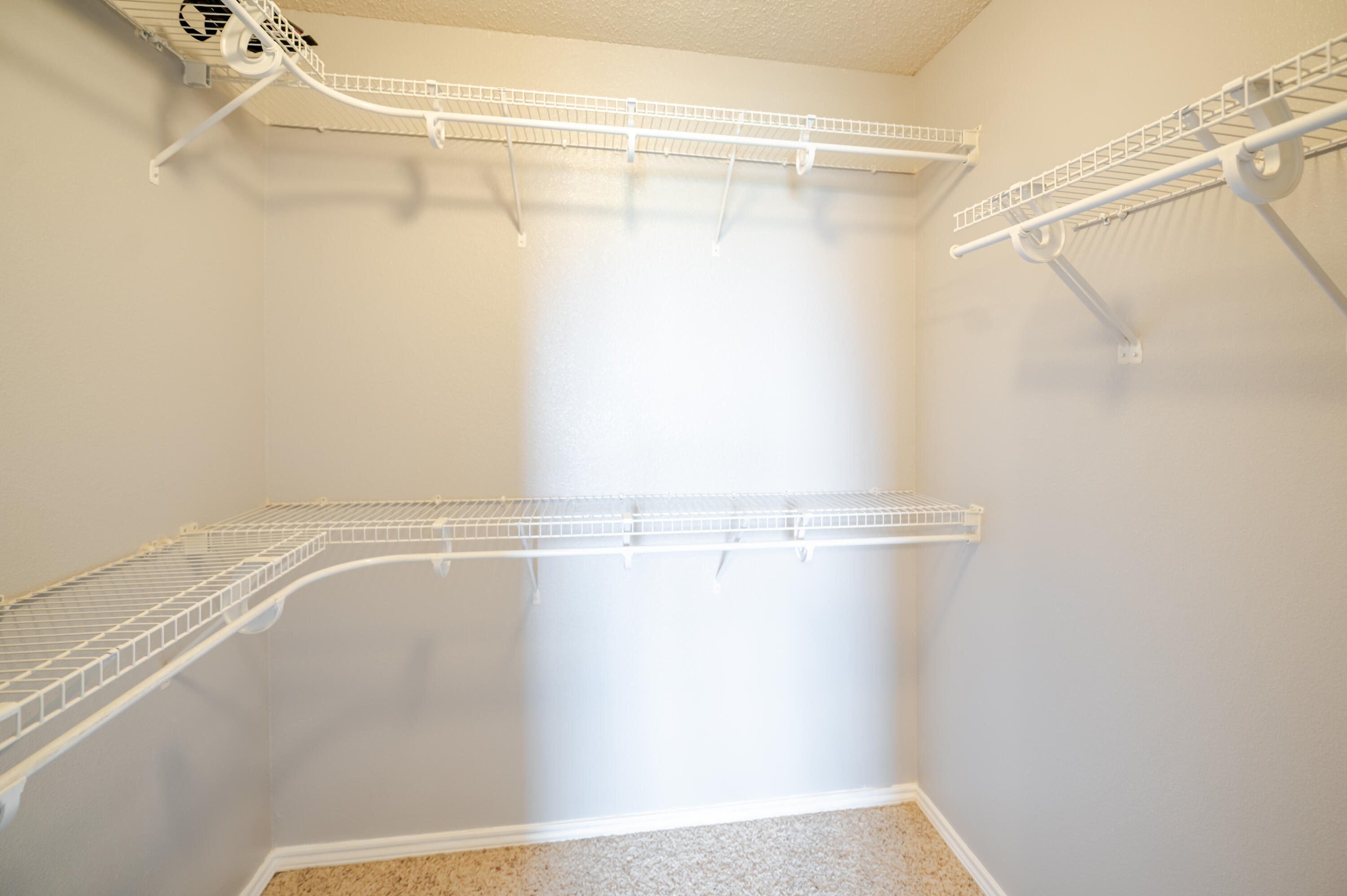2111 Main Street, Unit 1 Lubbock, TX 79401 - Photo 16 of 36 a view of a room with racks on the wall