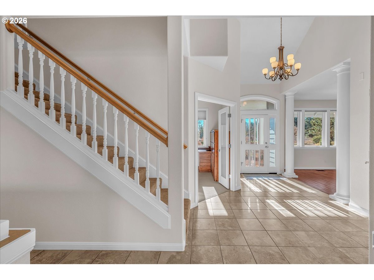 34043 Bennett Road Warren, OR 97053 - Photo 16 of 46 a view interior of a house with an entryway and chandelier