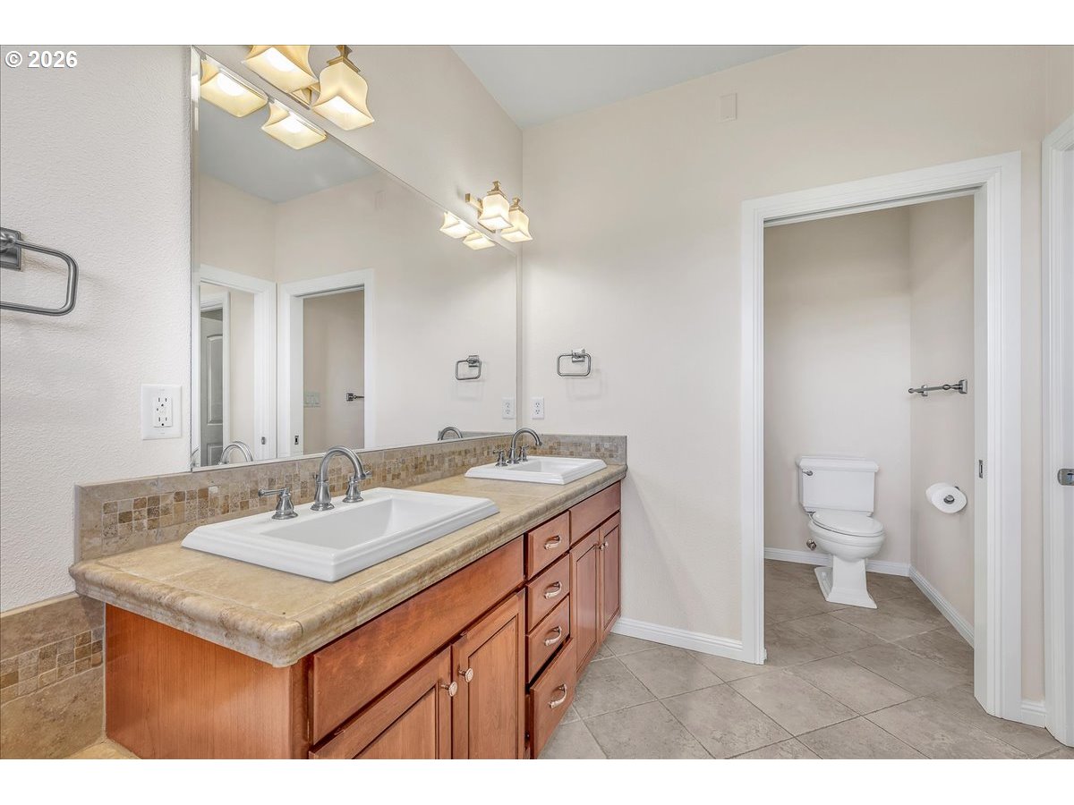 34043 Bennett Road Warren, OR 97053 - Photo 34 of 46 a bathroom with a sink a toilet and a mirror