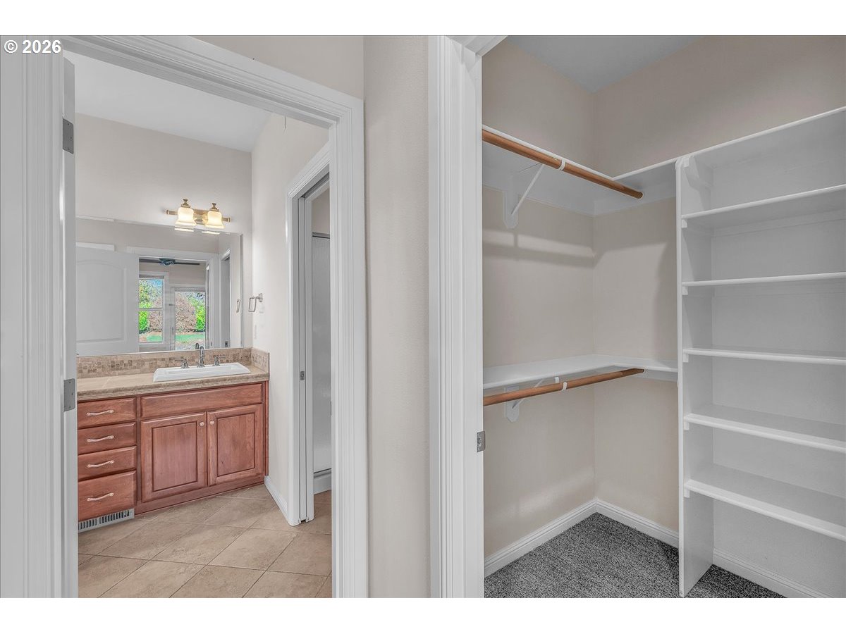34043 Bennett Road Warren, OR 97053 - Photo 36 of 46 a bathroom with a granite countertop sink shower and a mirror